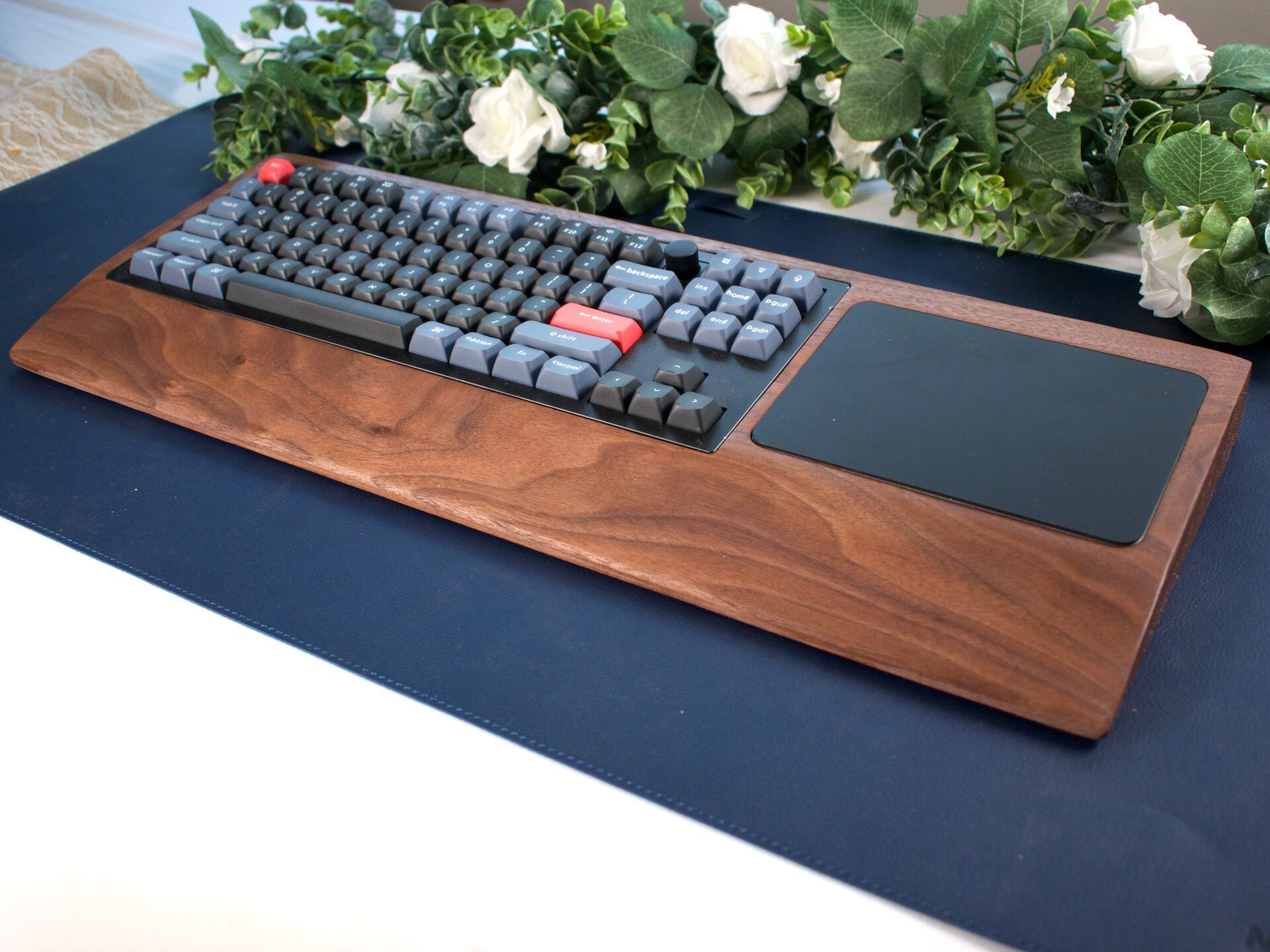 Walnut keyboard tray with mechanical keyboard and trackpad